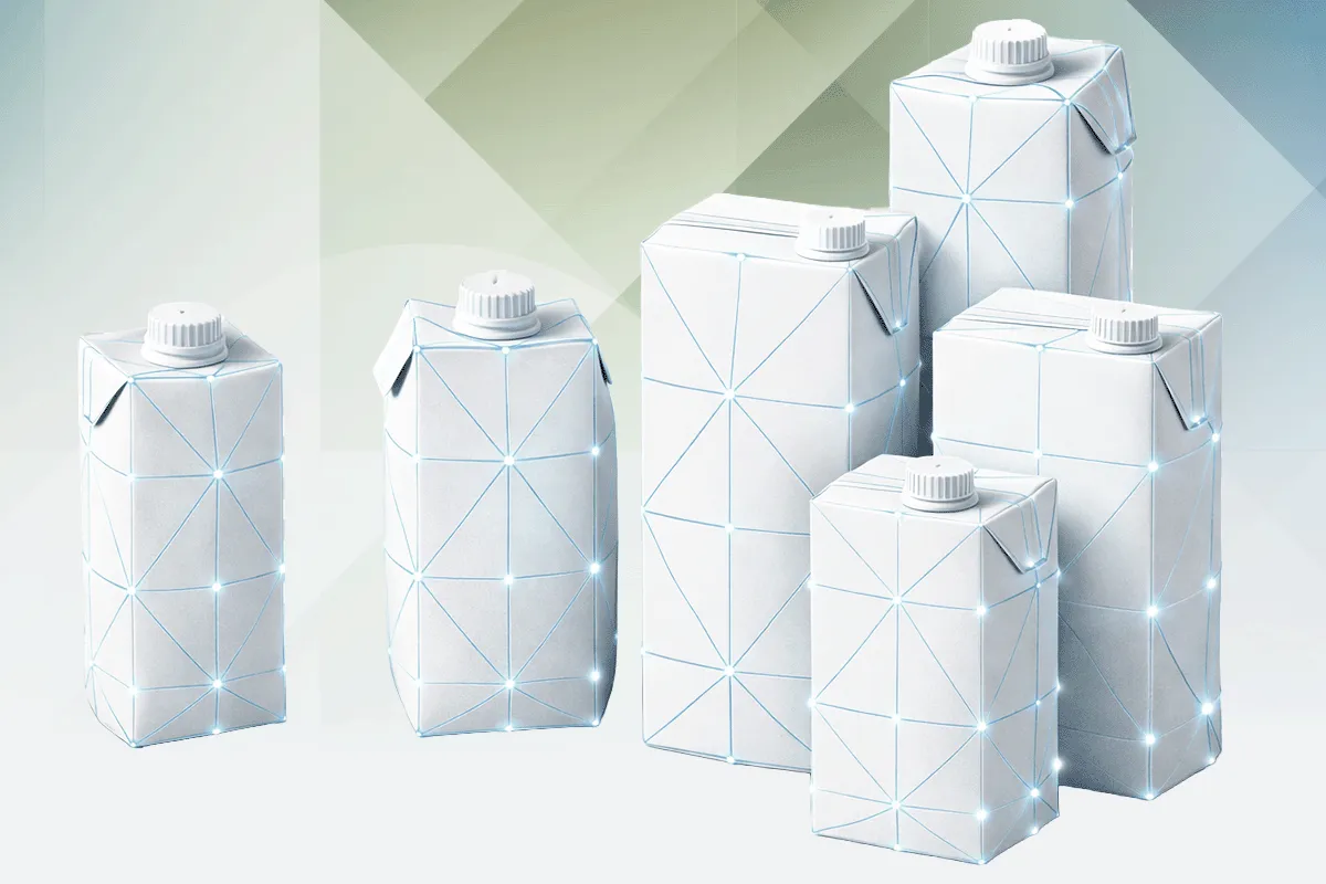 Physical beverage carton mockups for juice, milk, and oat drinks